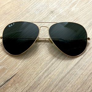Authentic Polarized Ray Ban aviators with black lenses.